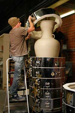 Scott Stacking Kiln on Ladder.jpg